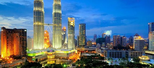 Kuala Lumpur skyline at night with the Petronas Towers